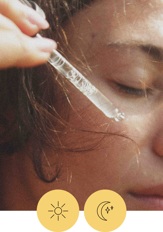 someone holds a pipette of Meadow Dew Facial Essence to their cheek. there are also two icons, one of a sun and one of a moon that indicates this is for daytime and nighttime use