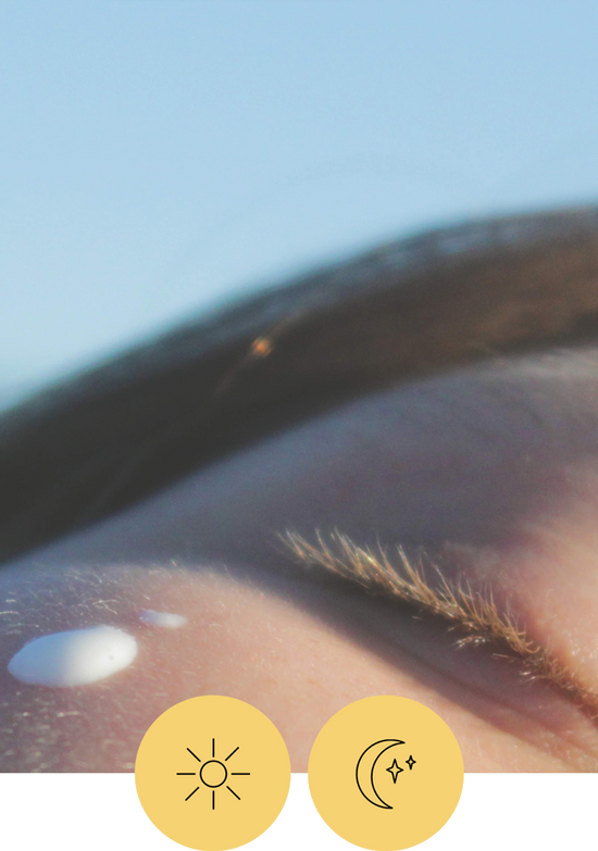 Close up of someone's eye with a couple droplets of Eye Care under their eye. There are also two icons, one of a sun and one of a moon that indicates this is for daytime and nighttime use