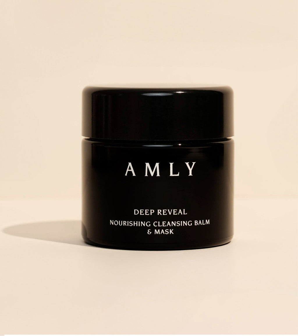 AMLY Deep Reveal Nourishing Cleansing Balm & Mask in a black glass jar on a beige background