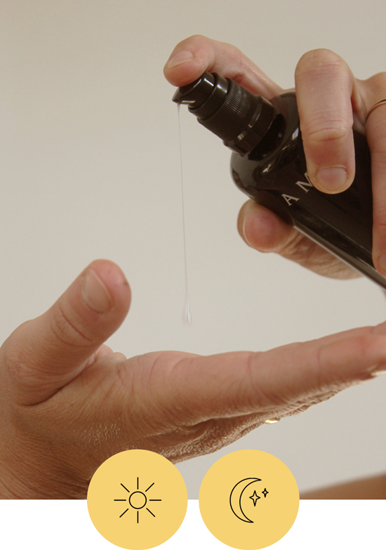 Someone pumps out a small amount of Fresh Faced Cleanser into their palm. there are also two icons, one of a sun and one of a moon that indicates this is for daytime and nighttime use