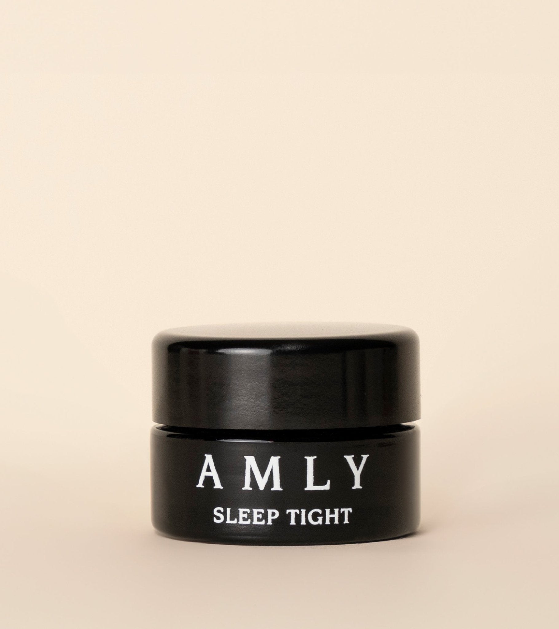 Sleep Tight Face Balm jar from the Sleep Night Kit on a beige background